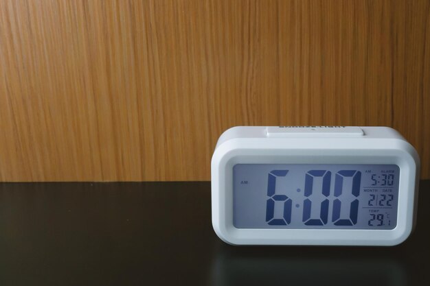 Close-up of alarm clock on table