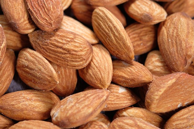 Close up of almond nuts in a bowl .