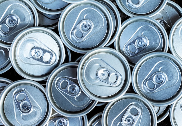 Close up aluminum can lids used for containing beverages
