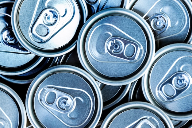 Close up aluminum can lids used for containing beverages