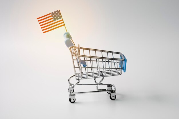 Photo close-up of american flag on shopping cart