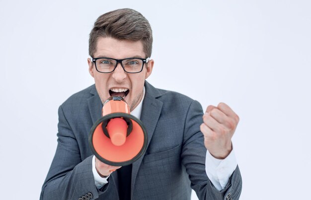 Close up angry businessman with a megaphoneisolated on white background