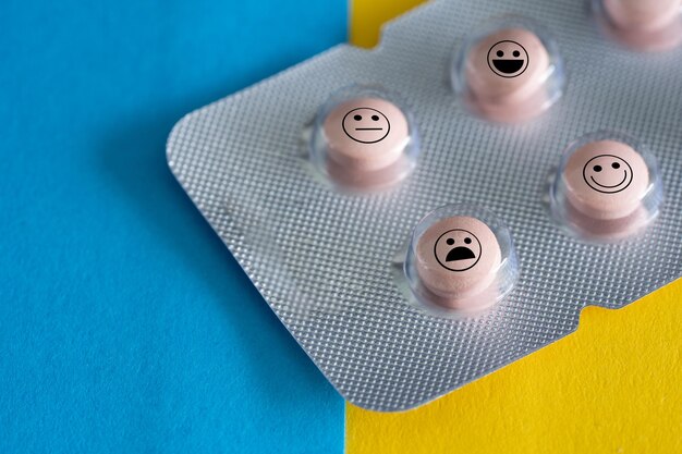 Close-up of anthropomorphic faces on blister pack