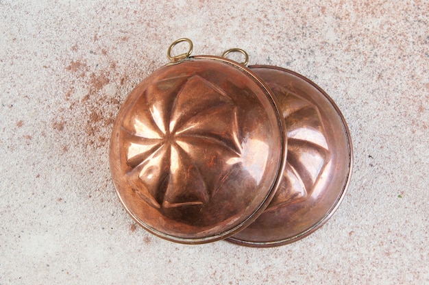 Close up on antique copper cake molds