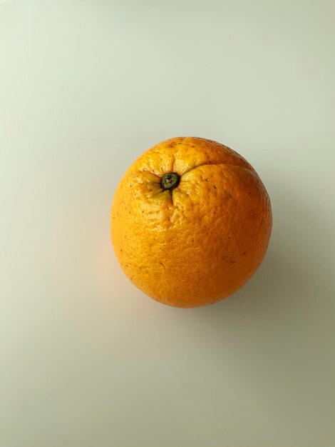 Close-up of apple against orange background