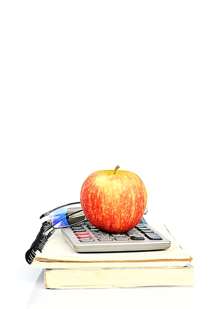 Close-up of apple on stack against white background