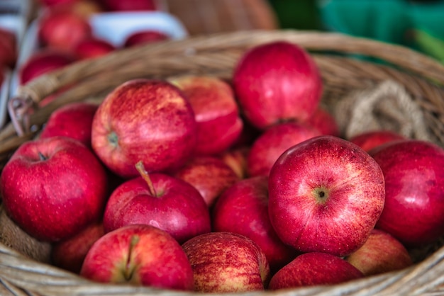 Close-up of apples in basket for sale at market