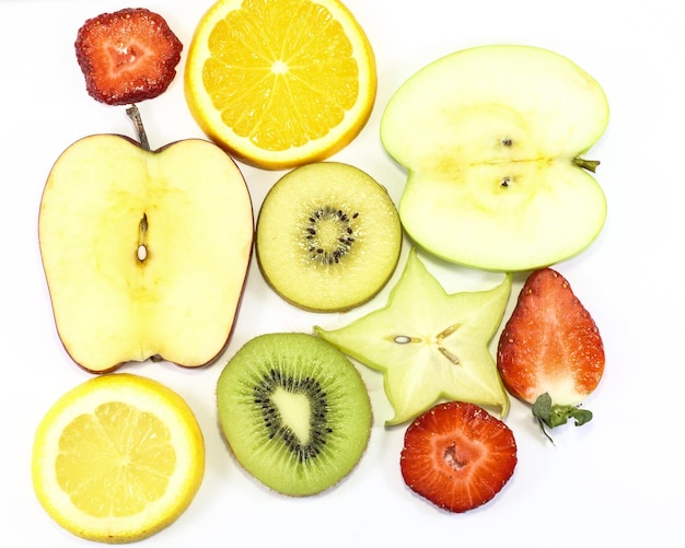 Photo close-up of apples and fruits on white background