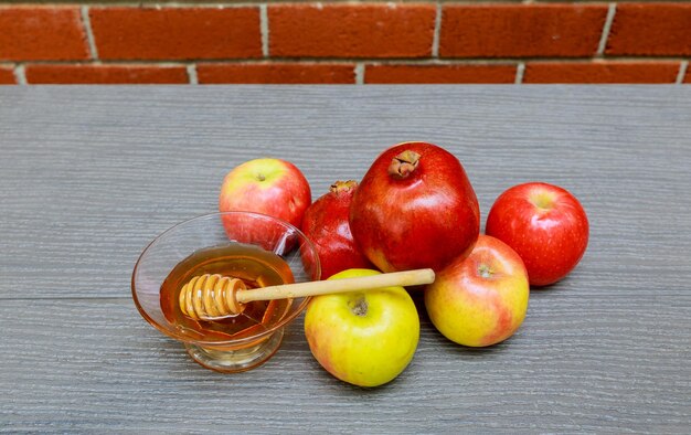 Close-up of apples with honey on table