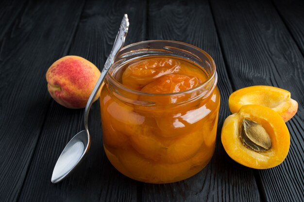 Close up on apricot jam with apricots