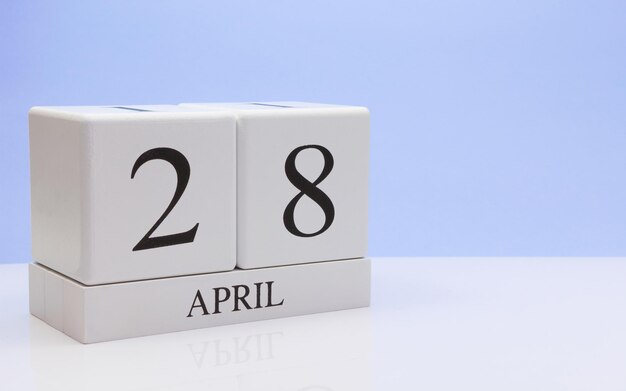 Close-up of april date against blue background