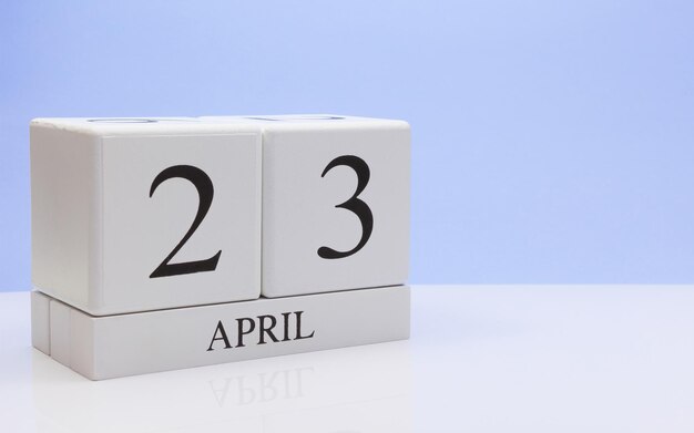 Close-up of april date against blue background