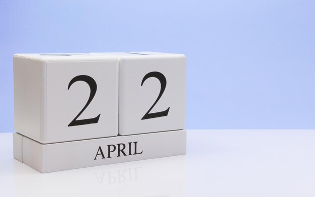 Photo close-up of april date against blue background
