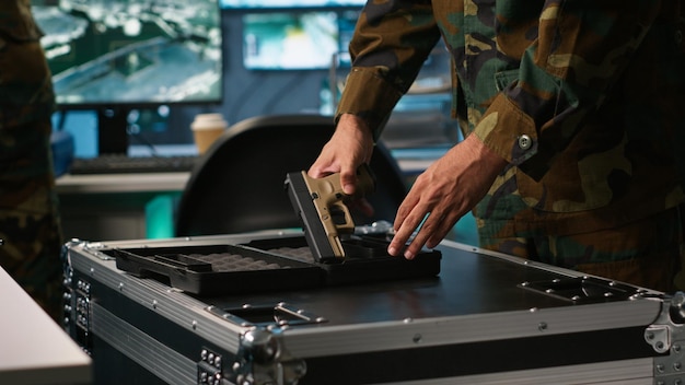 close up of army soldier in command center packing guns