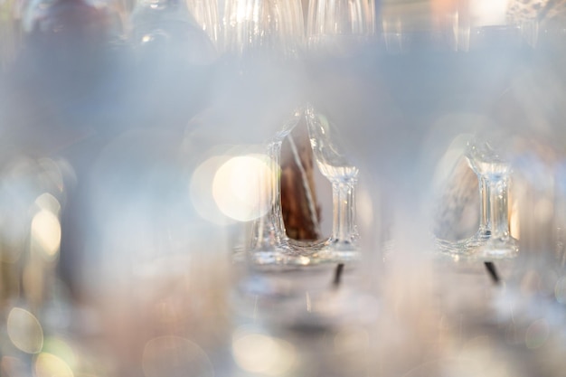 Close up arranged glass on the table in abstract field in celebration time for any luxury background