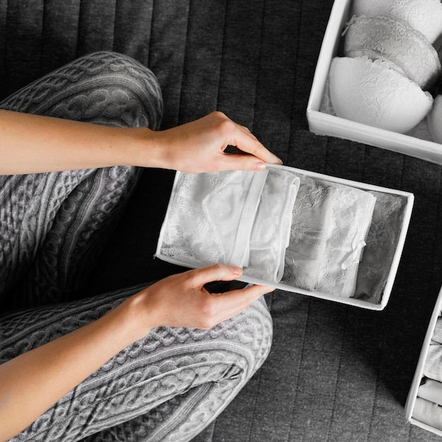 Photo close up arranging female underwear