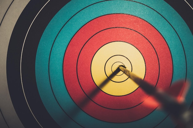 Close-up of arrow in bulls eye