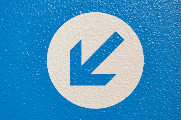 Close-up of arrow symbol on wall