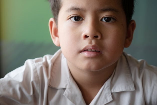 Close up asian boy showing feeling