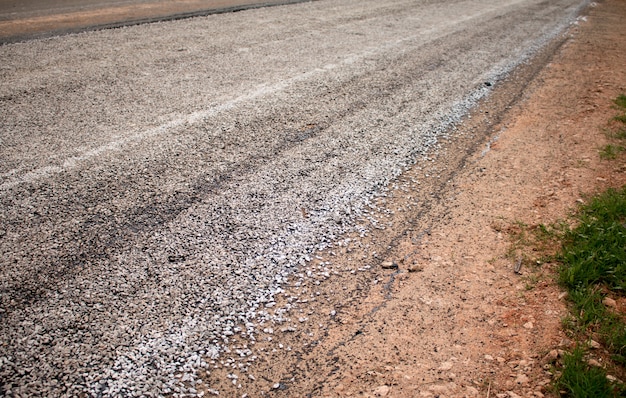 Close-up asphalt at the road under construction.