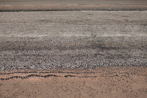 Close-up asphalt at the road under construction.