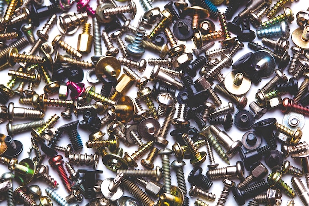 Close up assortment many different bolts and screwsxA