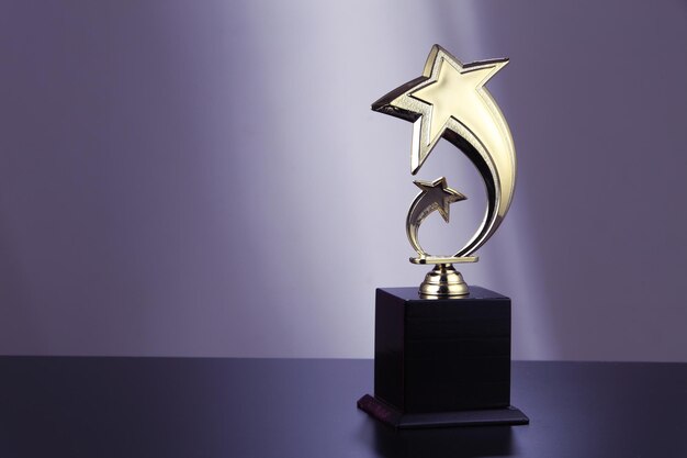 Photo close-up of award on table against wall