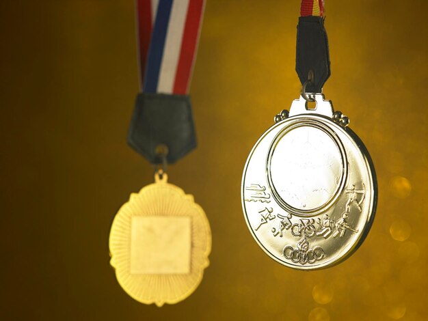 Close-up of awards against golden background