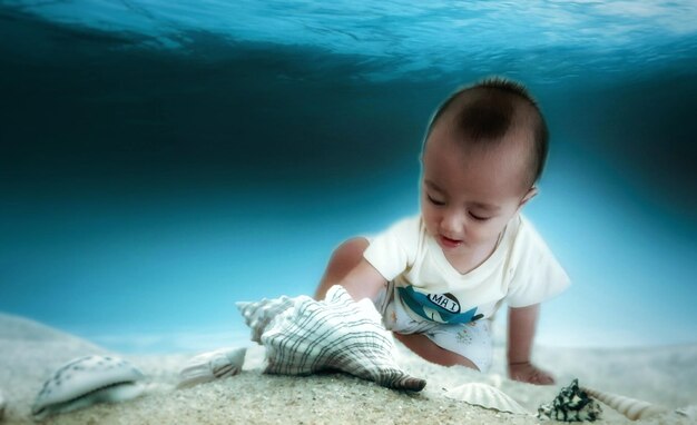 Close-up of baby boy in swimming pool