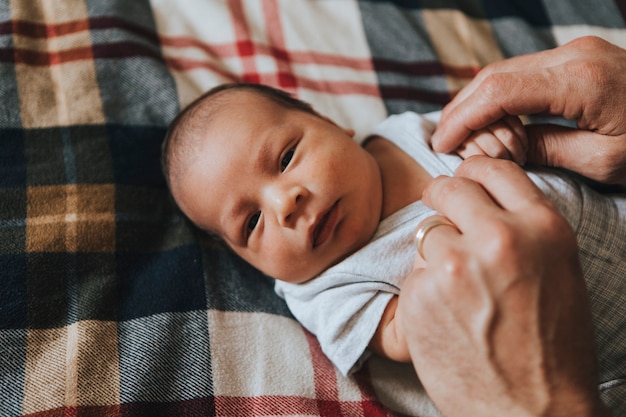 Close up of a baby having his diaper changed