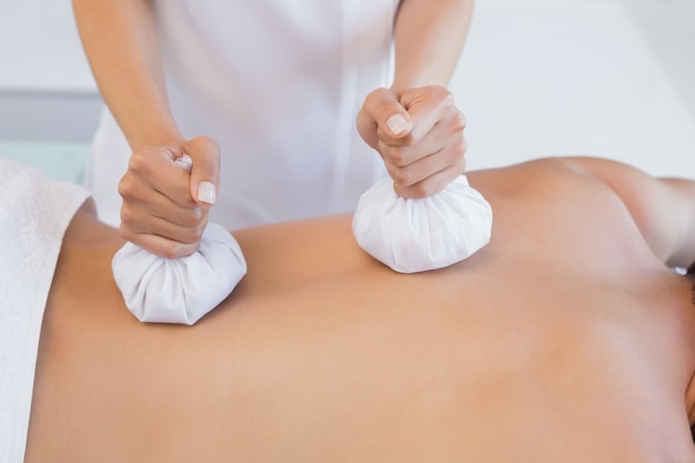 Close up of back massage at spa center