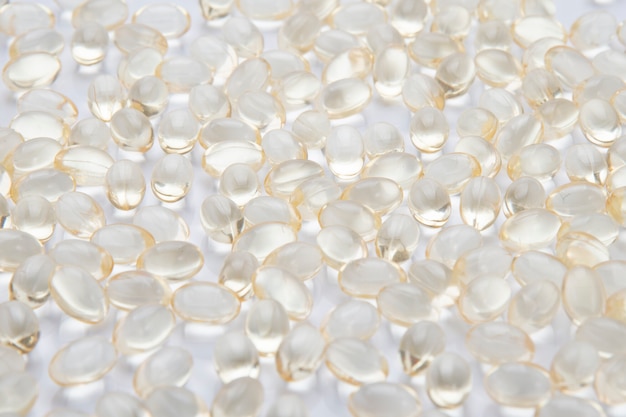 Close up background of a pile of oil capsules