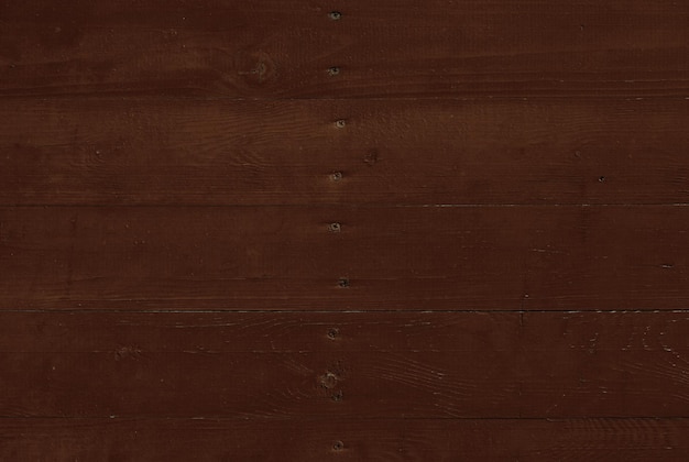 Close up background texture of dark brown vintage weathered painted wooden planks rustic style wall panel