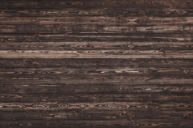 結び目や汚れのあるヴィンテージ風化茶色の木板の背景テクスチャをクローズアップ