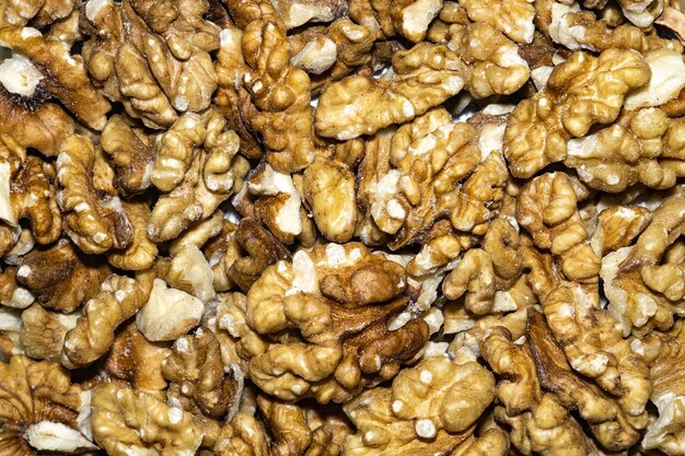 Photo close up background with peeled walnuts macro photo