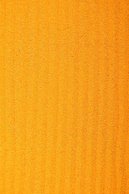 Photo close up background of yellow sand textured