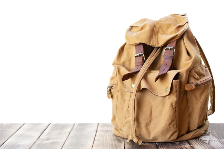 Photo close-up of backpack on table against white background
