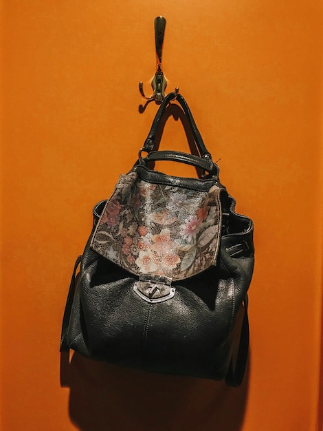 Close-up of bag hanging on wall