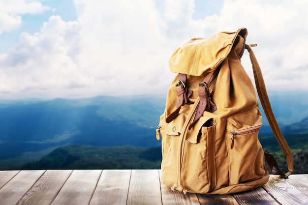 Photo close-up of bag on wood against sky