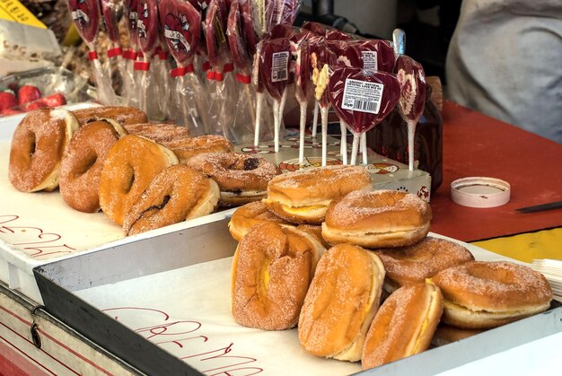 close-up of baked buns and lollipops for sale