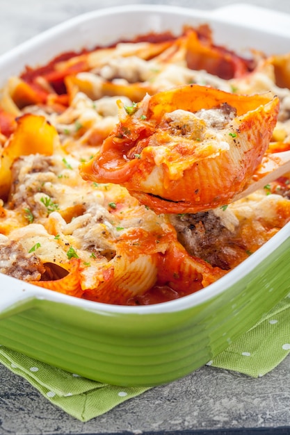 Close up on baked stuffed pasta shells