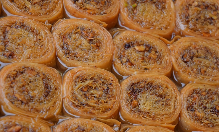 Photo close-up of baklava s for sale in shop