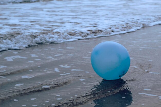 close-up of balloon on beach