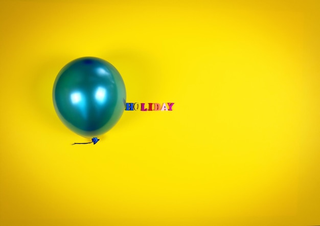 Close-up of balloon on yellow background