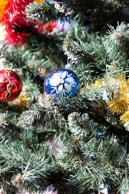 Close up of balls on christmas tree Bokeh garlands in the background