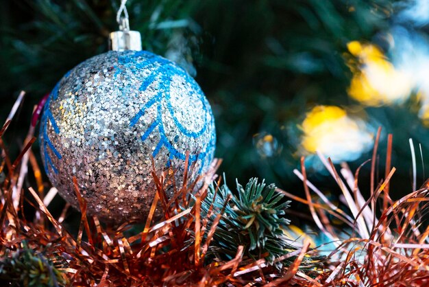 Close up of balls on christmas tree Bokeh garlands in the background