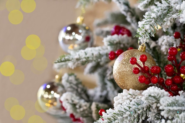 Close up of balls on christmas tree Bokeh garlands in the background