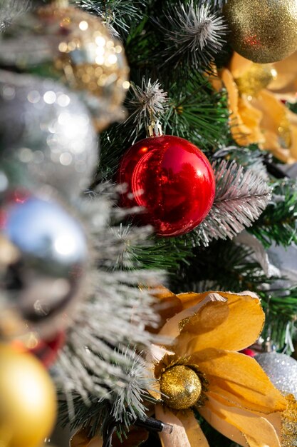 Close up of balls on christmas tree Bokeh garlands in the background