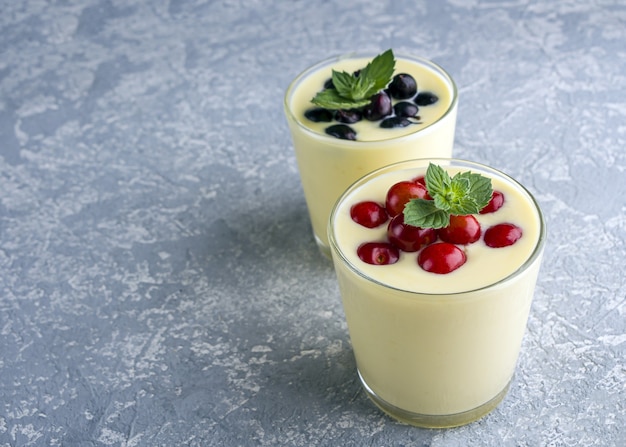 Close-up of banana yogurt and fresh fruits in a glass