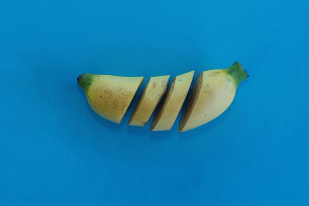 Close-up of bananas against blue background